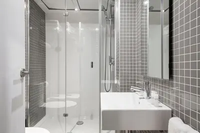 a bathroom with a shower and a sink and a mirror at Barcelona Apartment Aramunt in Barcelona