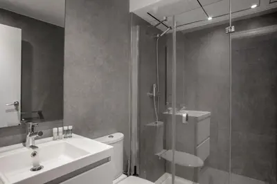a bathroom with a shower and a toilet and a sink at Barcelona Apartment Aramunt in Barcelona