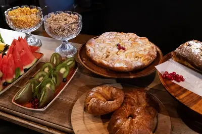 a table topped with different types of bread and pastries at Chic & Basic Born Boutique Hotel in Barcelona