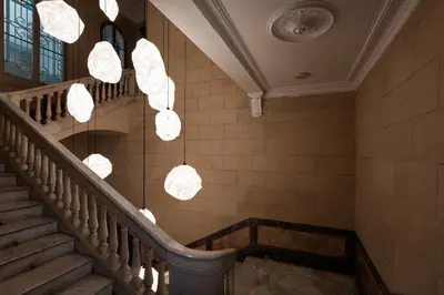 a staircase with chandeliers in a building at Chic & Basic Born Boutique Hotel in Barcelona