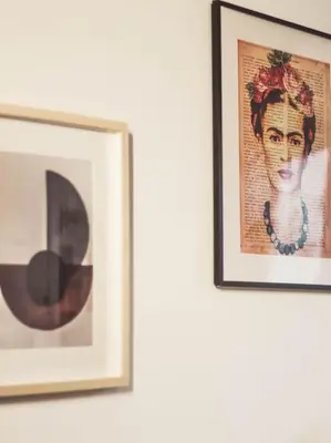 two framed pictures of a woman on a wall at MODERN FLAT POBLE NOU in Barcelona