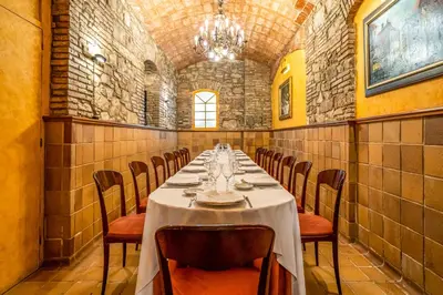 a long dining room with a table and chairs at Hotel Rialto in Barcelona
