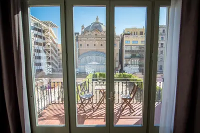 a view of a city from a window at Petit Palace Museum in Barcelona
