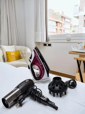 a table with a hair dryer and a vacuum at Vilana Hotel Boutique in Barcelona