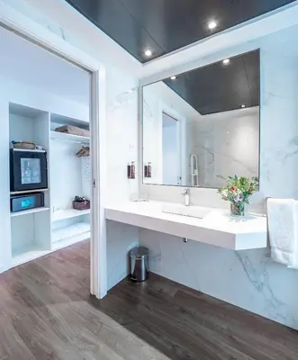 a bathroom with a sink and a mirror at Vilana Hotel Boutique in Barcelona