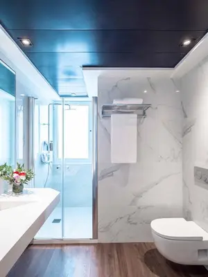 a bathroom with a glass shower and a toilet at Vilana Hotel Boutique in Barcelona