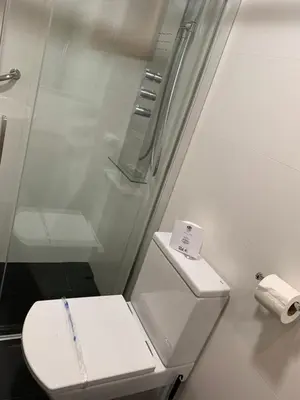 a bathroom with a toilet and a glass shower at Galeón in Sitges