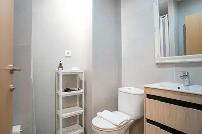 a bathroom with a toilet and a sink at Beautiful apartment in Las Ramblas Barcelona 6pax in Barcelona