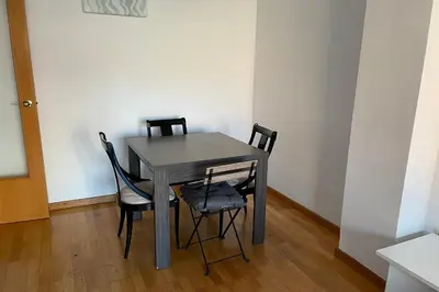 a gray table and two chairs in a room at NEW! Amazing 2 bedroom apartment in Rambla del Poblenou in Barcelona