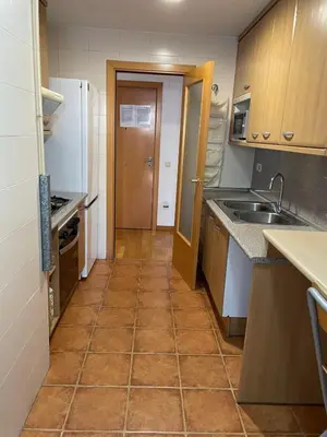 a small kitchen with a sink and a refrigerator at NEW! Amazing 2 bedroom apartment in Rambla del Poblenou in Barcelona
