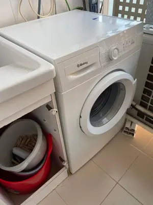 a washing machine in a kitchen with a sink at NEW! Amazing 2 bedroom apartment in Rambla del Poblenou in Barcelona