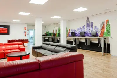 a living room with a couch and a table at Checkin Montserrat in Collbató