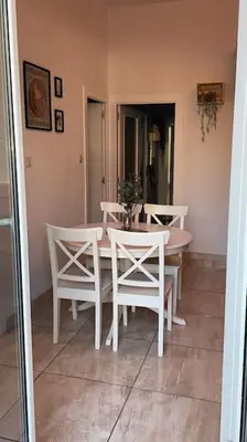 a dining room with a table and white chairs at Paseo de gracia gran vía de les corts catalanes in Barcelona