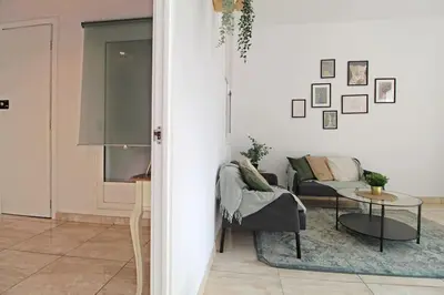 a living room with a table and a couch at Paseo de gracia gran vía de les corts catalanes in Barcelona