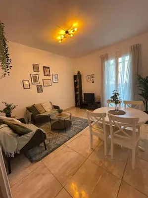a living room with a white table and chairs at Paseo de gracia gran vía de les corts catalanes in Barcelona