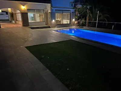 a house with a swimming pool at night at Costa Maresme Barcelona , Relax & Pool in Cabrils