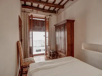 a bedroom with a bed and a large window at Beach Villa Aralinn by Hello Homes Sitges in Sitges