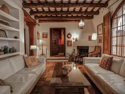 a living room with a couch and a table at Beach Villa Aralinn by Hello Homes Sitges in Sitges