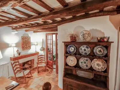 a dining room with plates on a wall at Beach Villa Aralinn by Hello Homes Sitges in Sitges