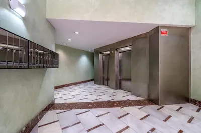 an empty hallway with elevators in a building at Espectacular loft en centrico edificio singular in Manresa