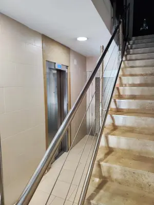 a stairway in a building with a hallway at Apartamento Diagonal Mar, cerca del Forum y Playa in Barcelona