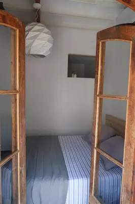 a room with a bunk bed and a ladder at CAM Maresme 2 Apartamento Barcelona y playa in Masnou