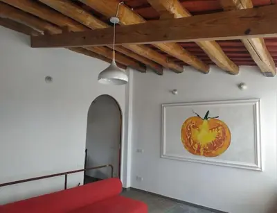 a room with a picture of a pumpkin on the wall at CAM Maresme 1 apartamento Barcelona y playa in Masnou