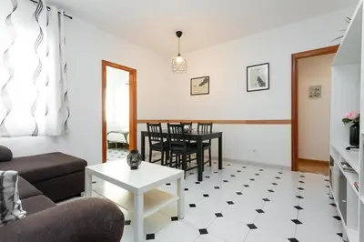 a living room with a couch and a table at Click&Flat Fira Castelao in Hospitalet de Llobregat