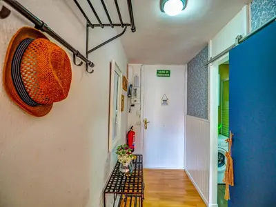 a small bathroom with a washing machine and a shower at The Blue Island Loft by Hello Homes Sitges in Sitges