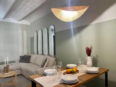 a living room with a white couch and a table at The Collection Barcelona - Plaza Catalunya Recently renovated 5BD-4BTH in Barcelona