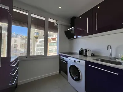 a living room with a table with plates and wine glasses at The Collection Barcelona - Plaza Catalunya Recently renovated 5BD-4BTH in Barcelona