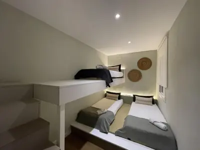 a small room with three bunk beds in it at The Collection Barcelona - Plaza Catalunya Recently renovated 5BD-4BTH in Barcelona