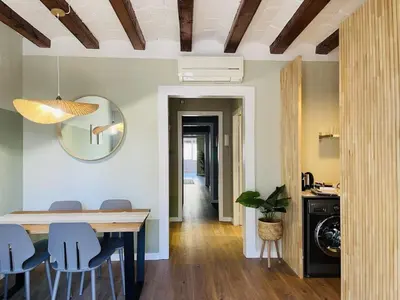 a bedroom with a large bed with a teddy bear on it at The Collection Barcelona - Plaza Catalunya Recently renovated 5BD-4BTH in Barcelona