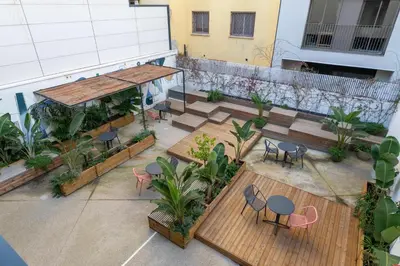an overhead view of a rooftop patio with tables and chairs at CATERINA 22@ POBLENOU in Barcelona