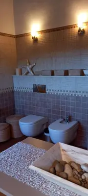 a bathroom with two toilets and a sink at Villa Alba cerca de Sitges in Canyelles