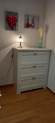 a white dresser with a lamp on top of it at Villa Alba cerca de Sitges in Canyelles