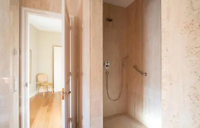 a bathroom with a shower with a glass door at Hotel Font de la Canya in Avinyonet