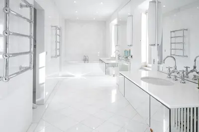 a white bathroom with two sinks and a tub at Hotel Font de la Canya in Avinyonet