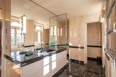 a large bathroom with two sinks and a large mirror at Hotel Font de la Canya in Avinyonet