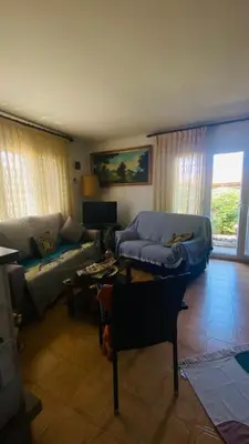 a living room with a couch and a table at Villa Òdena in Odena