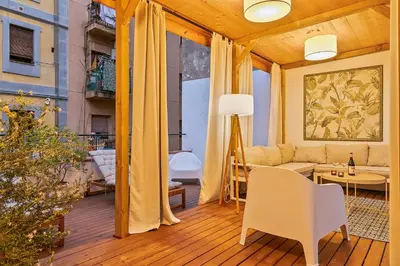 a living room with a couch and a table at Penthouse with Rooftop apartment in the Barceloneta - Barcelona in Barcelona