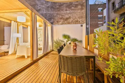 a dining room with a table and some plants at Penthouse with Rooftop apartment in the Barceloneta - Barcelona in Barcelona