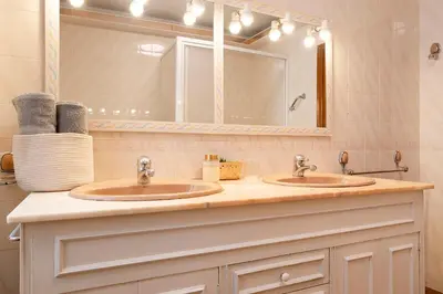 a bathroom with two sinks and a mirror at Barcelona Beach Home in Barcelona