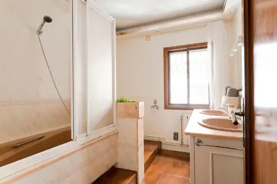 a bathroom with a sink and a shower at Barcelona Beach Home in Barcelona
