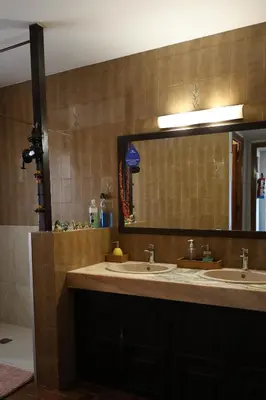 a bathroom with a toilet and a glass shower at El Cedre Blau Vivienda con piscina en Granollers in Granollers