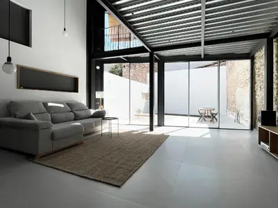 a living room with a couch and a table at villa en el penedès in Gornal