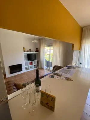 a kitchen with a counter with wine glasses on it at RACÓ DEL GARRAF Ca la Matilde house BBQ and POOL in Olivella