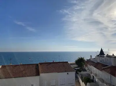 a view of the ocean from the roofs of buildings at Montaber Apartments - Sant Pol de Mar in San Pol de Mar