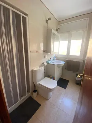 a bathroom with a toilet and a sink at Pisito bonito y funcional en Pineda De Mar in Pineda de Mar