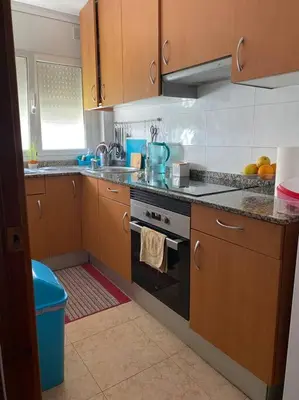 a kitchen with a sink and a stove top oven at Pisito bonito y funcional en Pineda De Mar in Pineda de Mar